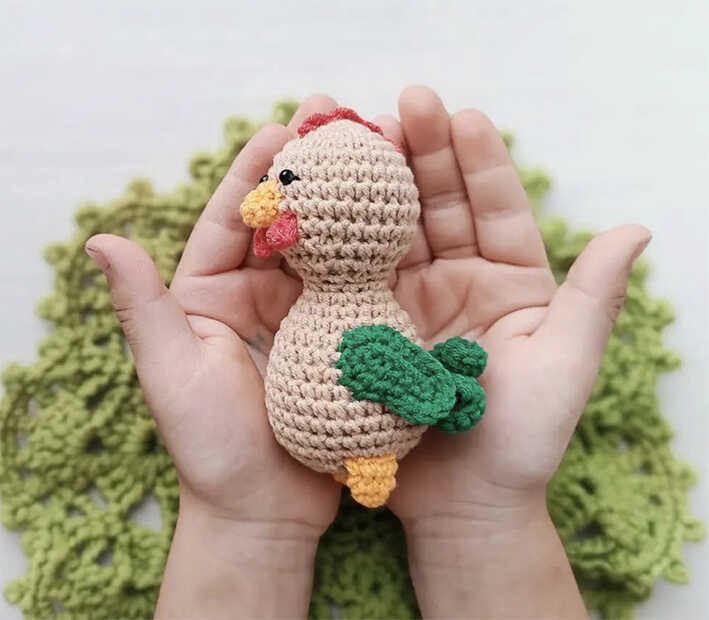 cute rooster amigurumi free crochet pattern small handmade toy held in hands