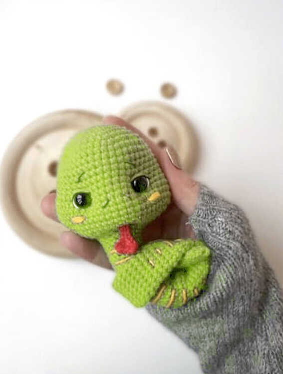 Cute green snake amigurumi with red tongue and embroidered body details