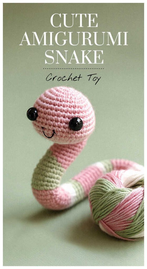 Pink and green cute amigurumi snake crochet toy with yarn skein, handmade snake plush idea for gift makers