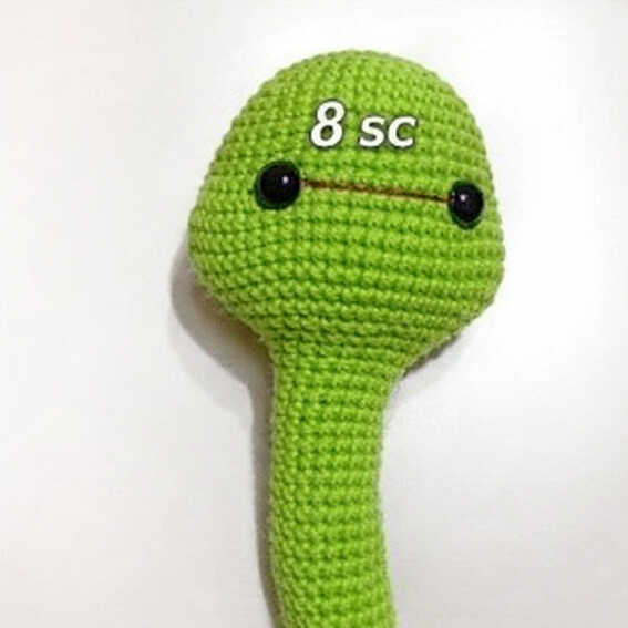 Snake amigurumi eye placement showing spacing before facial shaping